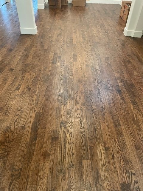 dark brown flooring with white posts