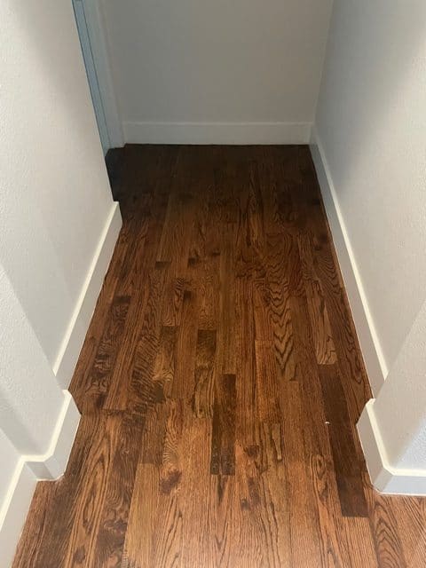dark hardwood flooring in corner