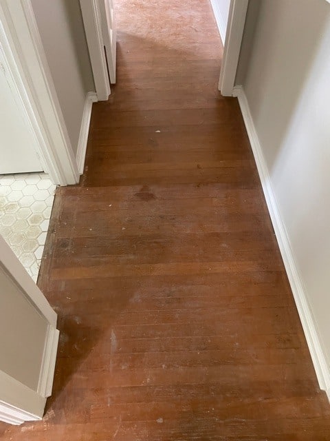 dark hardwood flooring install with dust