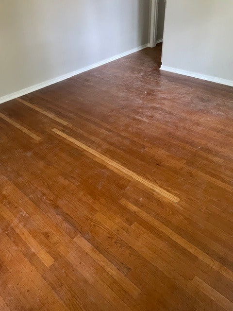hardwood flooring before install with dust on flooring