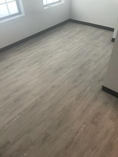 grey hardwood flooring with windows