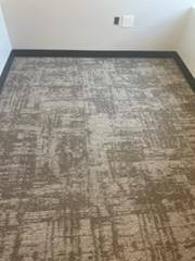grey carpet design with black baseboards